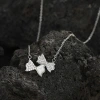 A light luxury golden collarbone chain supply, featuring a female mother-of-pearl necklace decorated with diamonds and a bow pendant Item Picture